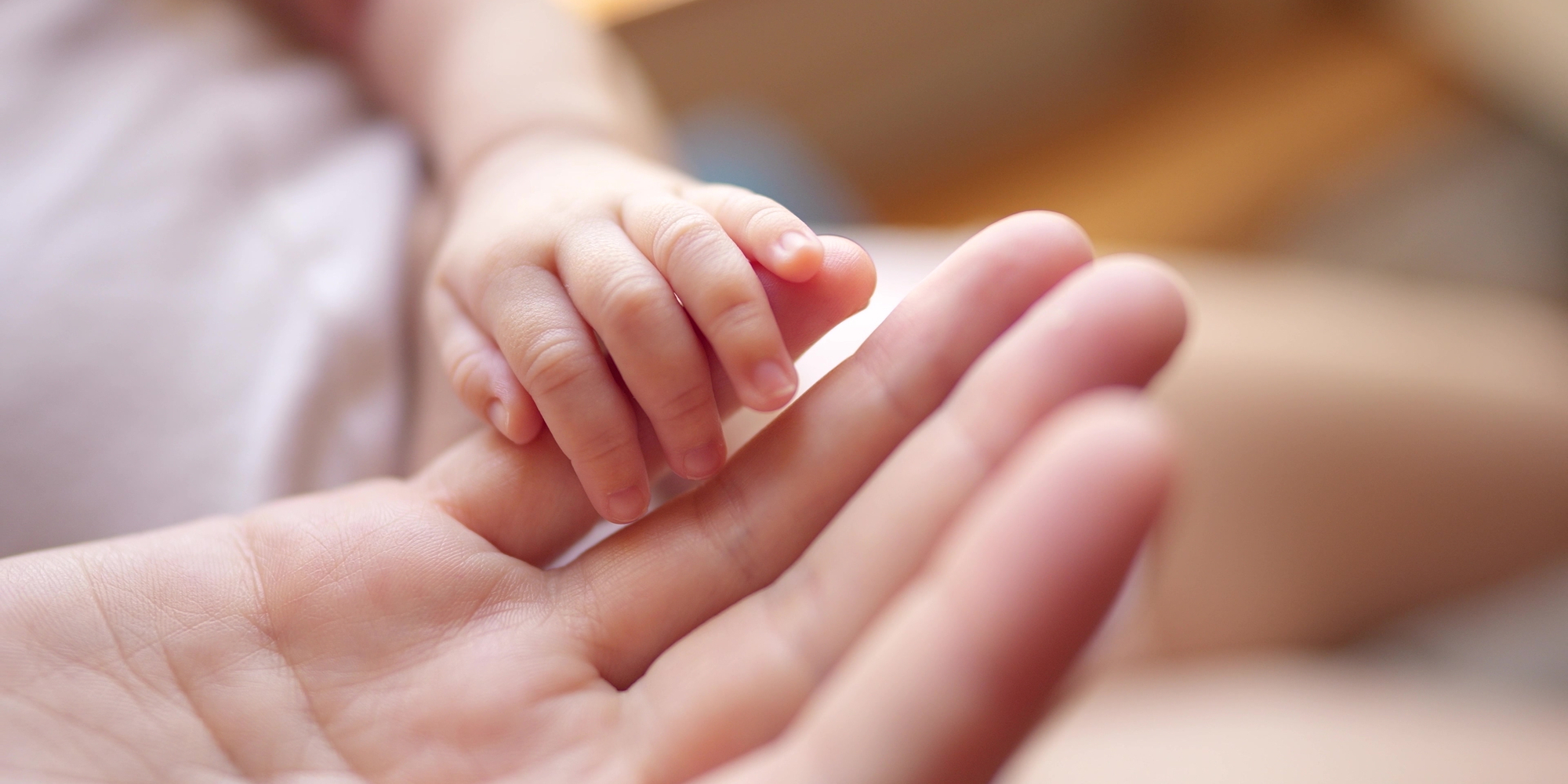 mother-holding-baby-newborn-hand-2368801265.jpg
