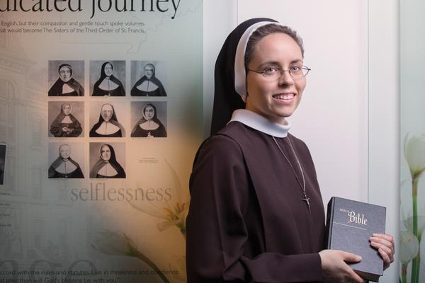 OSF Sister Smiling and Holding the Bible