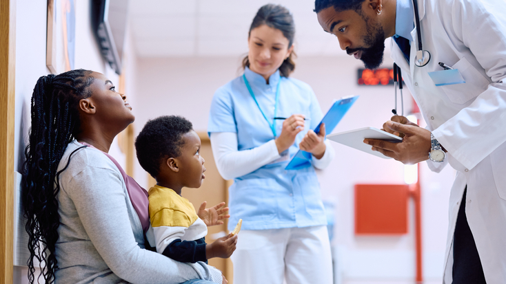 doctor communicating small boy