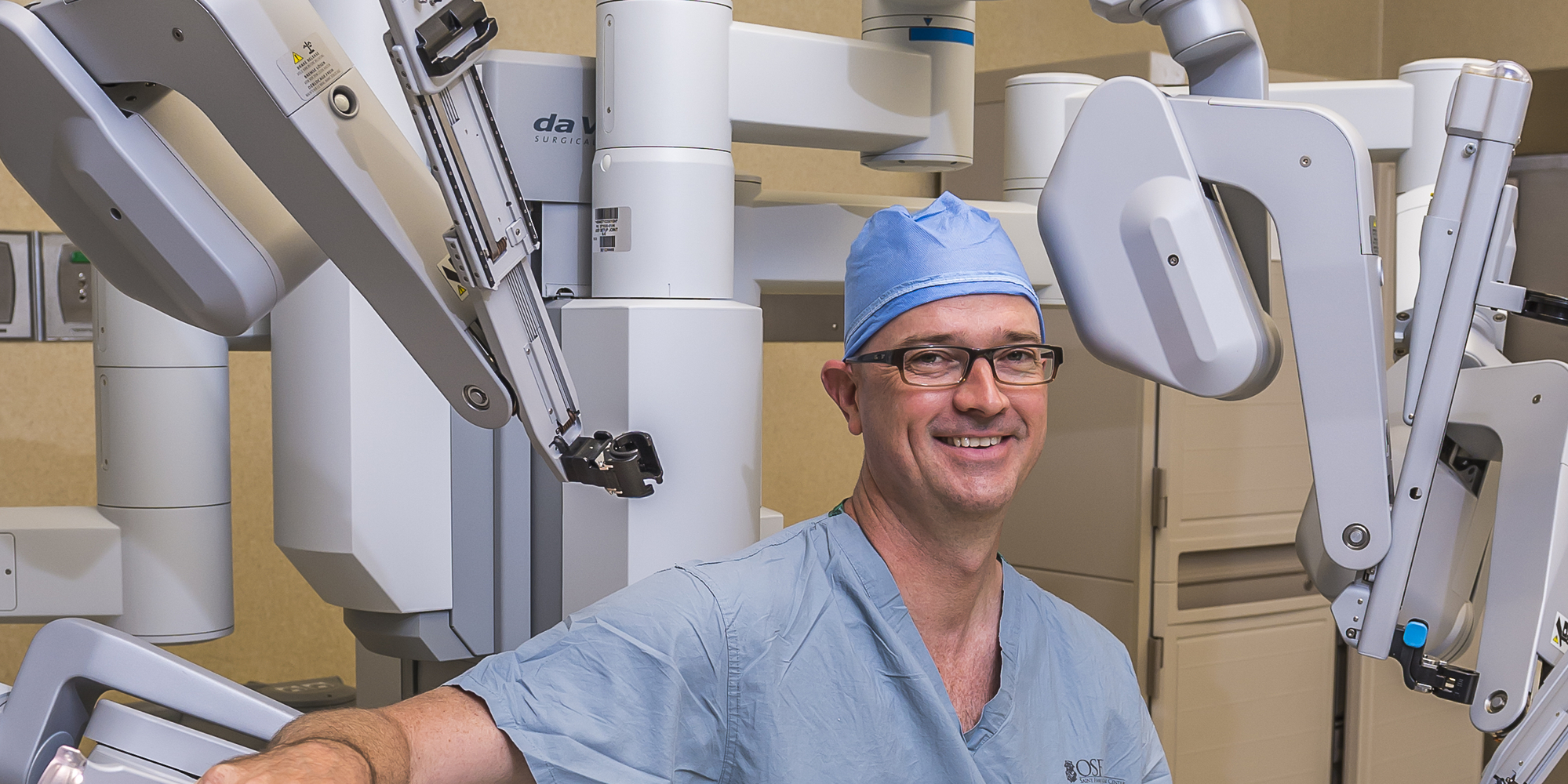 Surgeon Leaning On a daVinci Robot Device