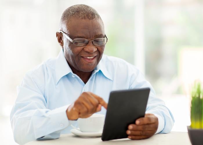 African American Gentleman Using Tablet