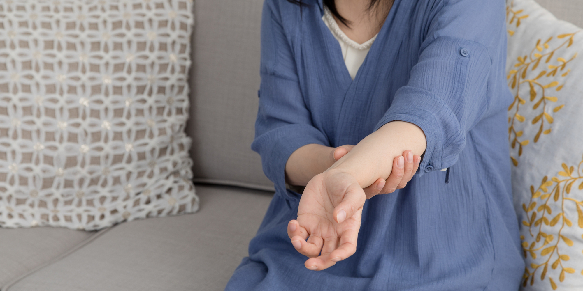 Women holding arm out