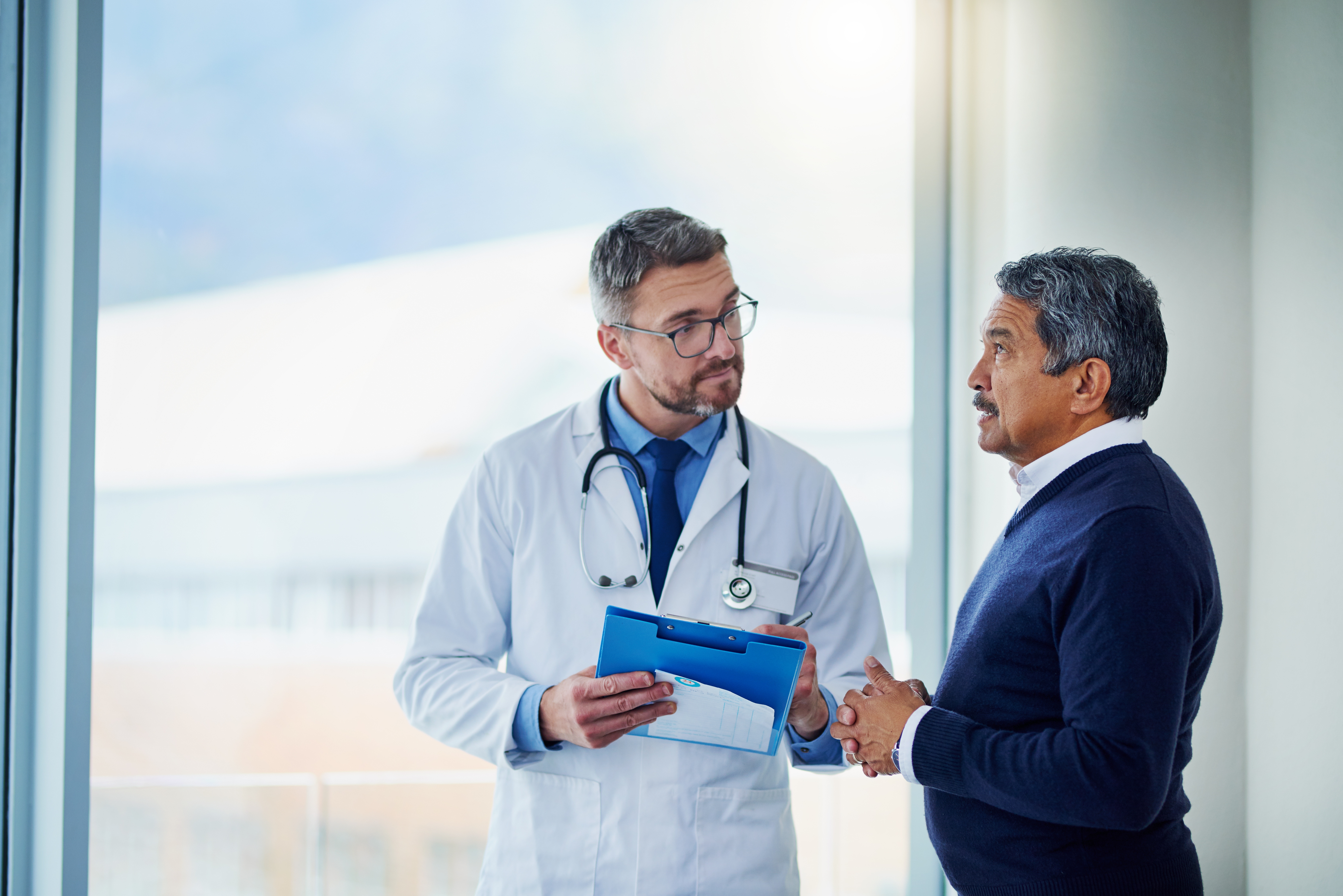 Doctor with patient talking about screening