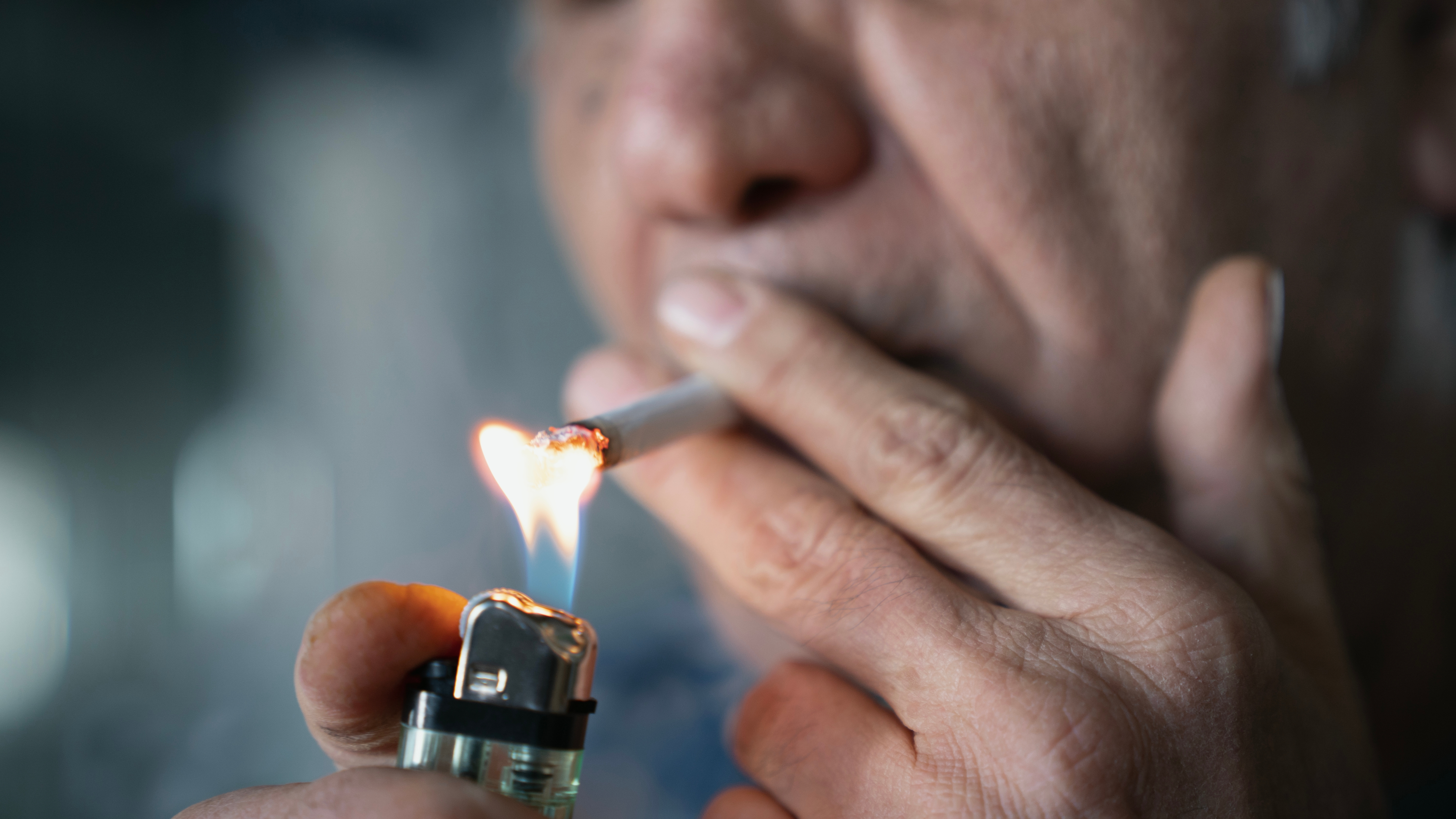 Man lighting cigarette