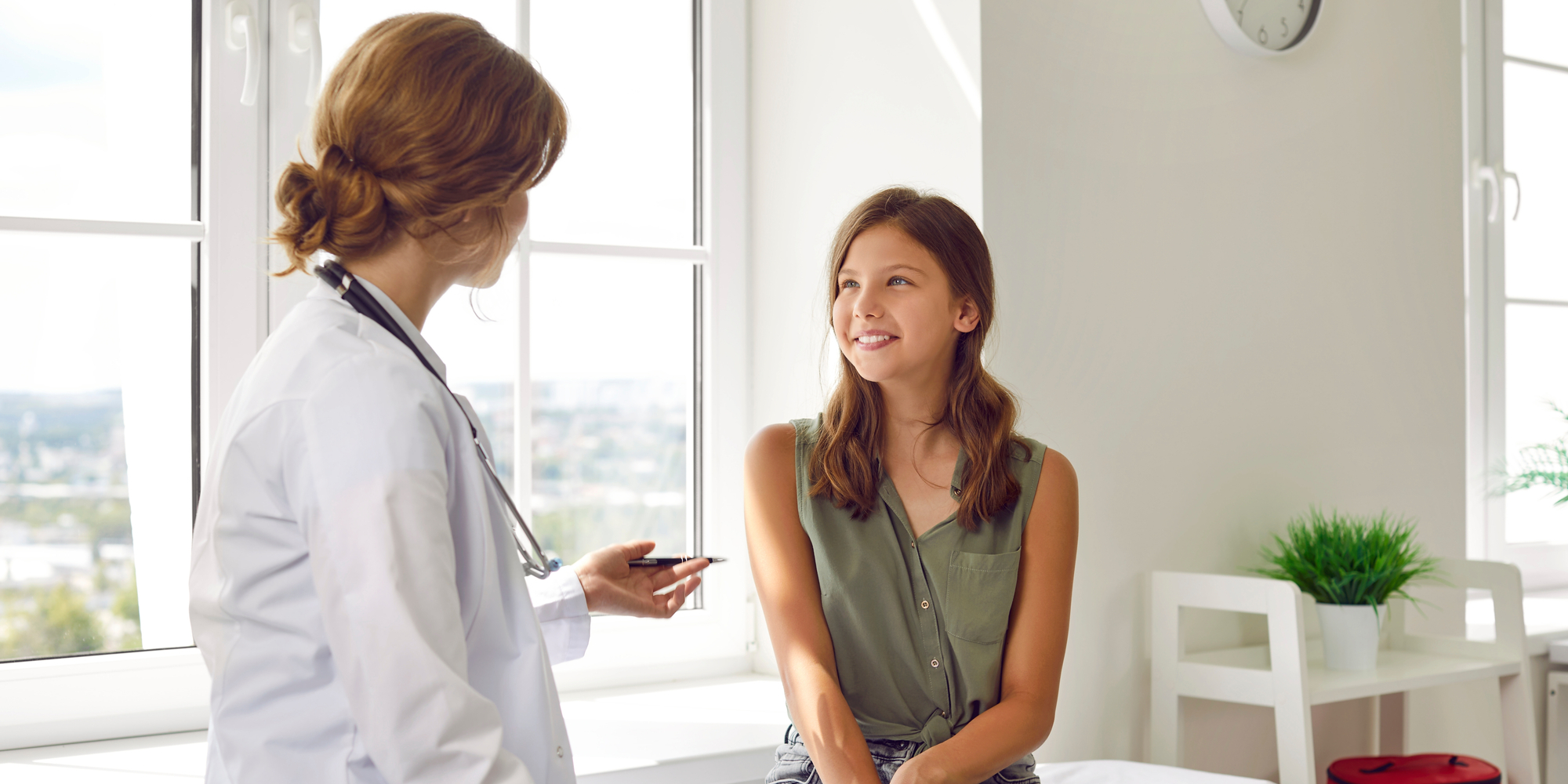 Doctor talking to teenage girl
