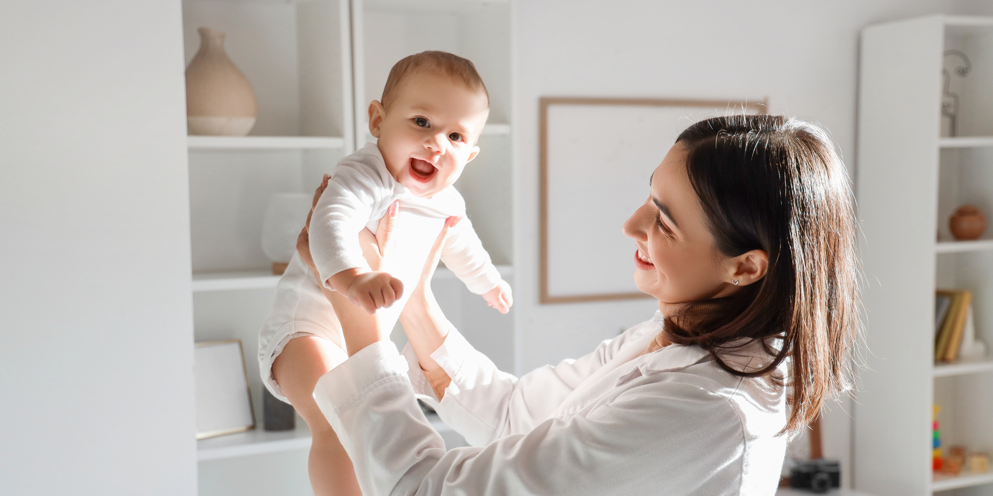pediatrician holding little baby