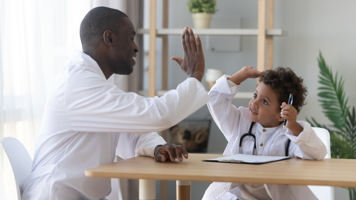 father and son playing doctor