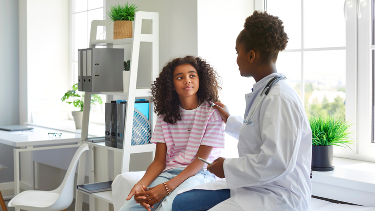 Doctor Talking with Girl Patient