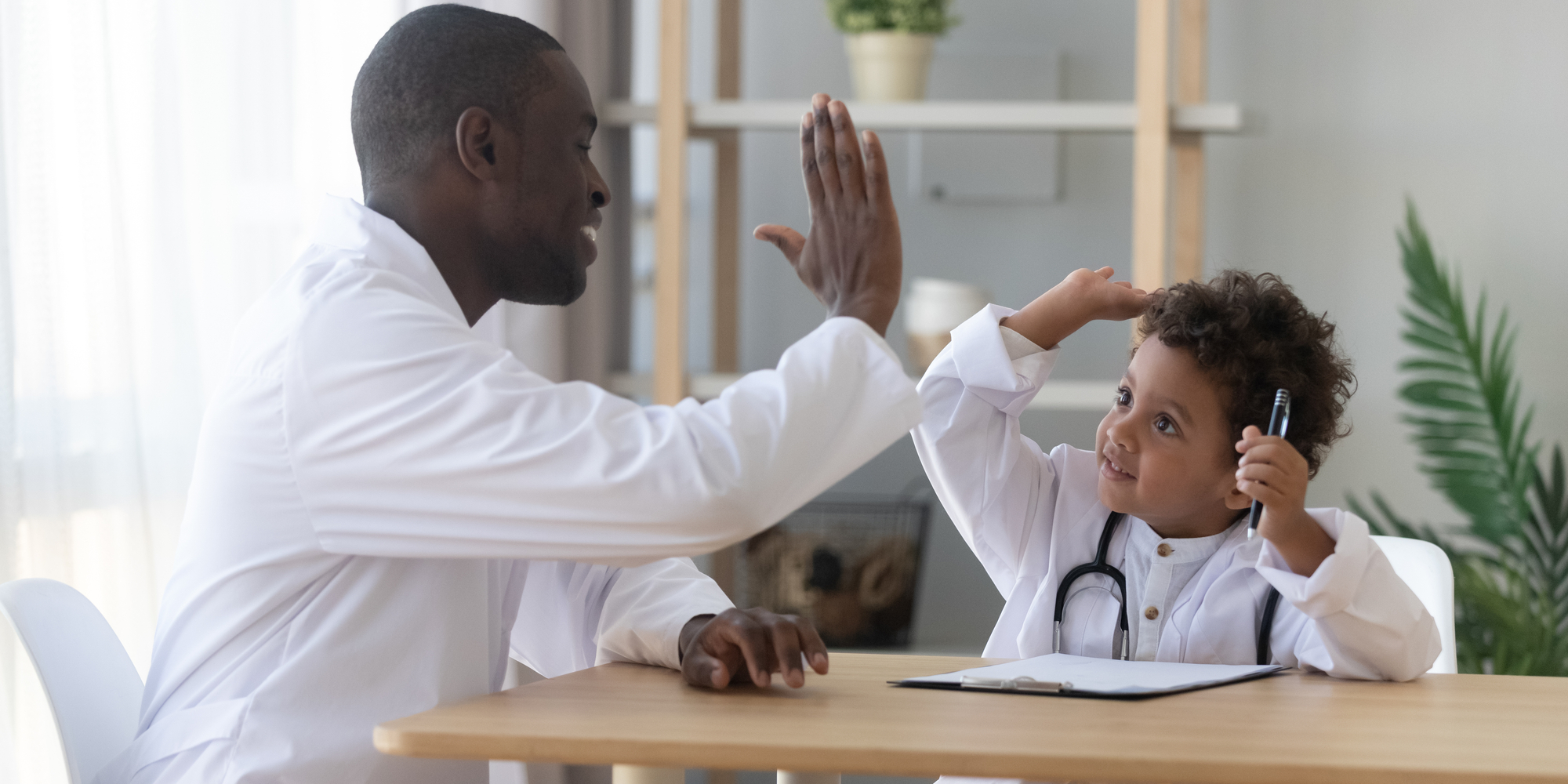father and son playing doctor