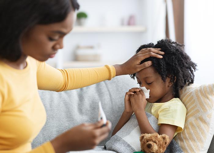 Woman With Child On Smart Phone