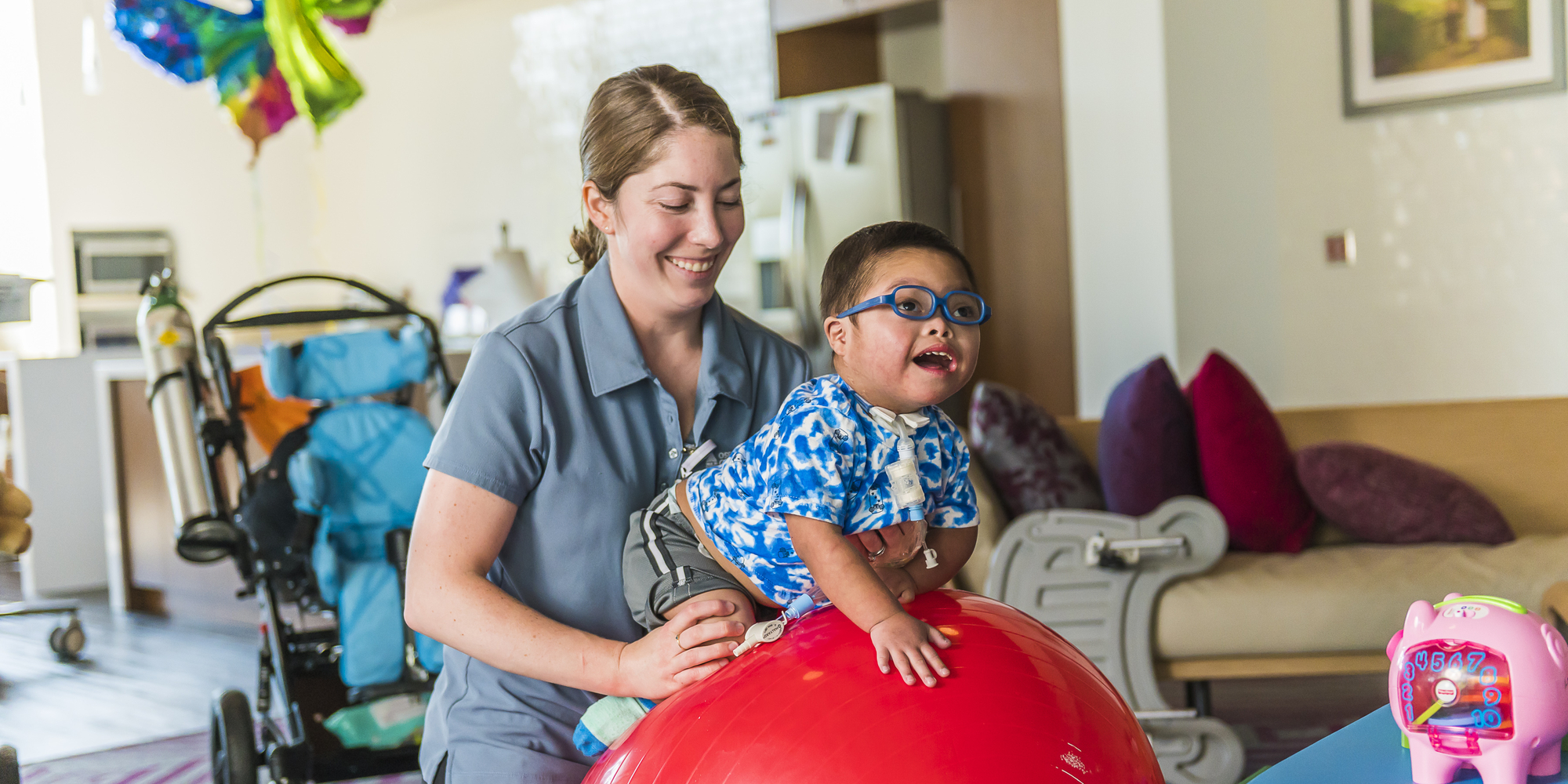 OSF Children's Hospital of Illinois nurse bouncing patient on ball