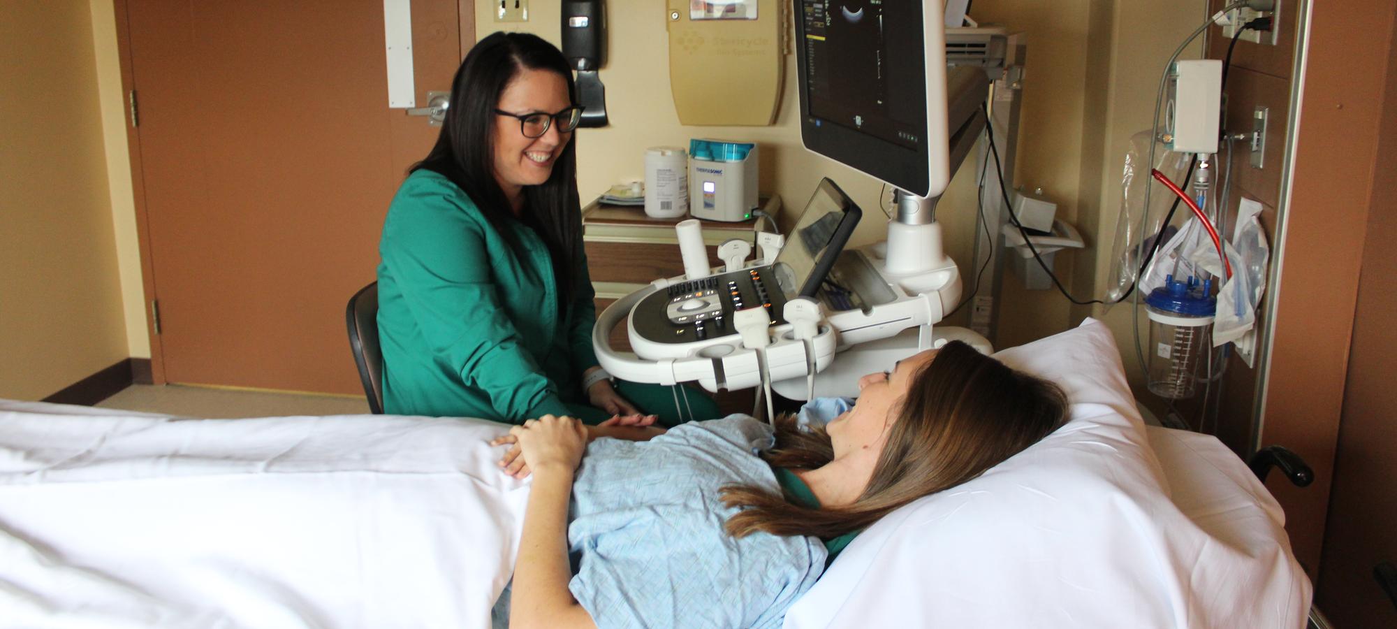 Nurse giving sonogram