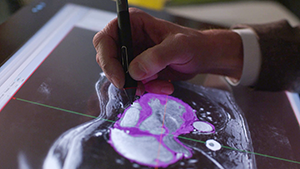 Hand tracing anatomy on screen