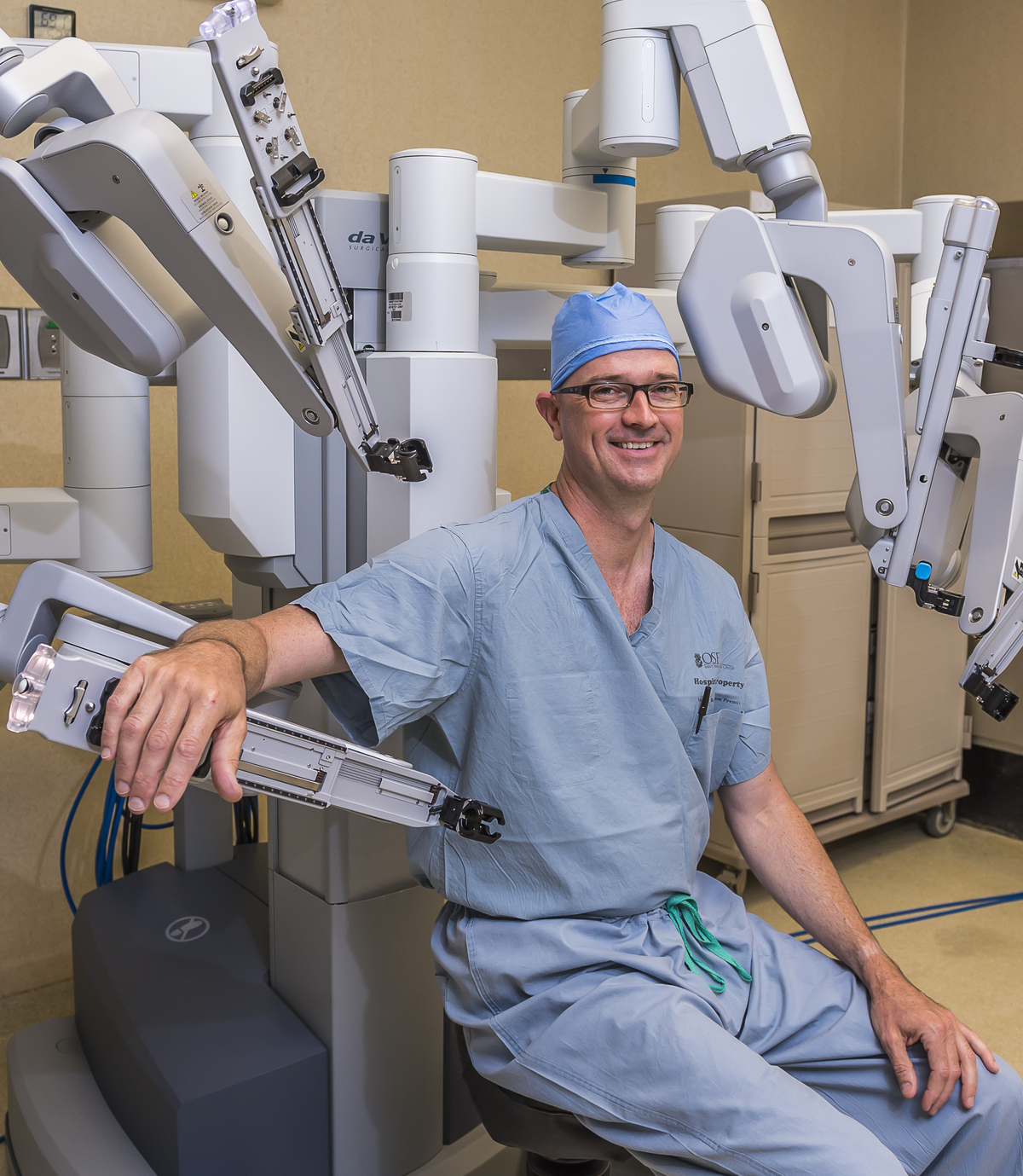 Surgeon Leaning On a daVinci Robot Device