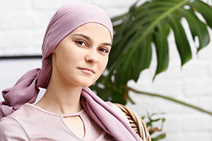 Oncology patient in front of greenery