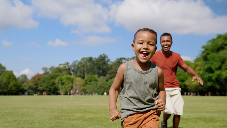 Boy and Male Adult Playing Outside