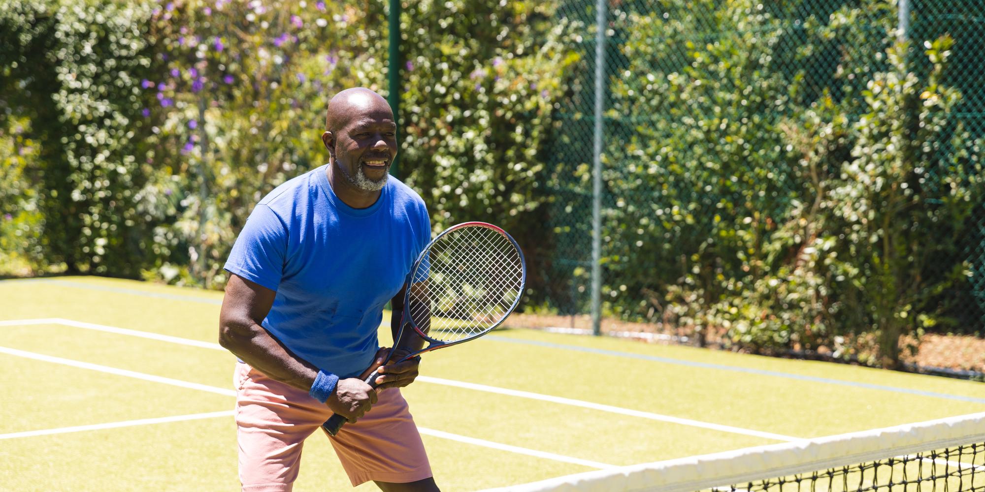 happy senior african american man playing