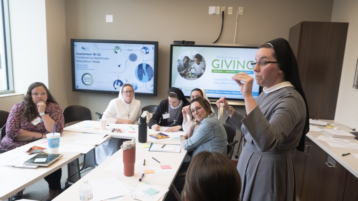 Sister Speaking to a Room of Mission Partners