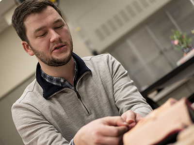 Engineer working with trainers on desk