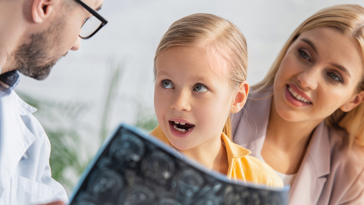 amazed kid looking family doctor