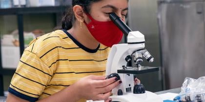 STEAM Student with microscope