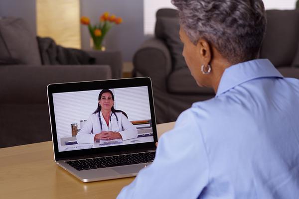 Laptop video visit with doctor