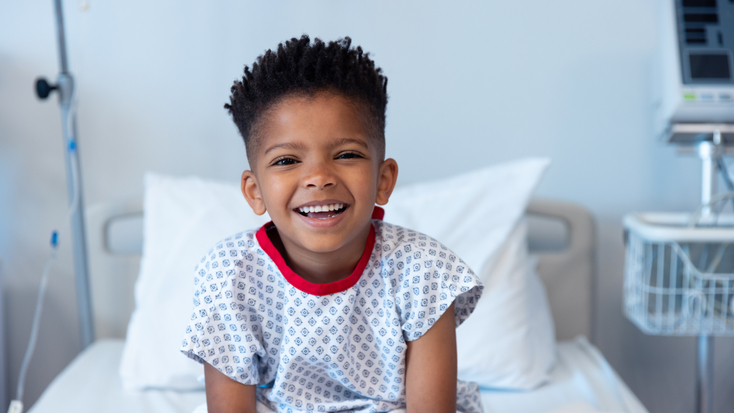 happy african american boy patient sitting