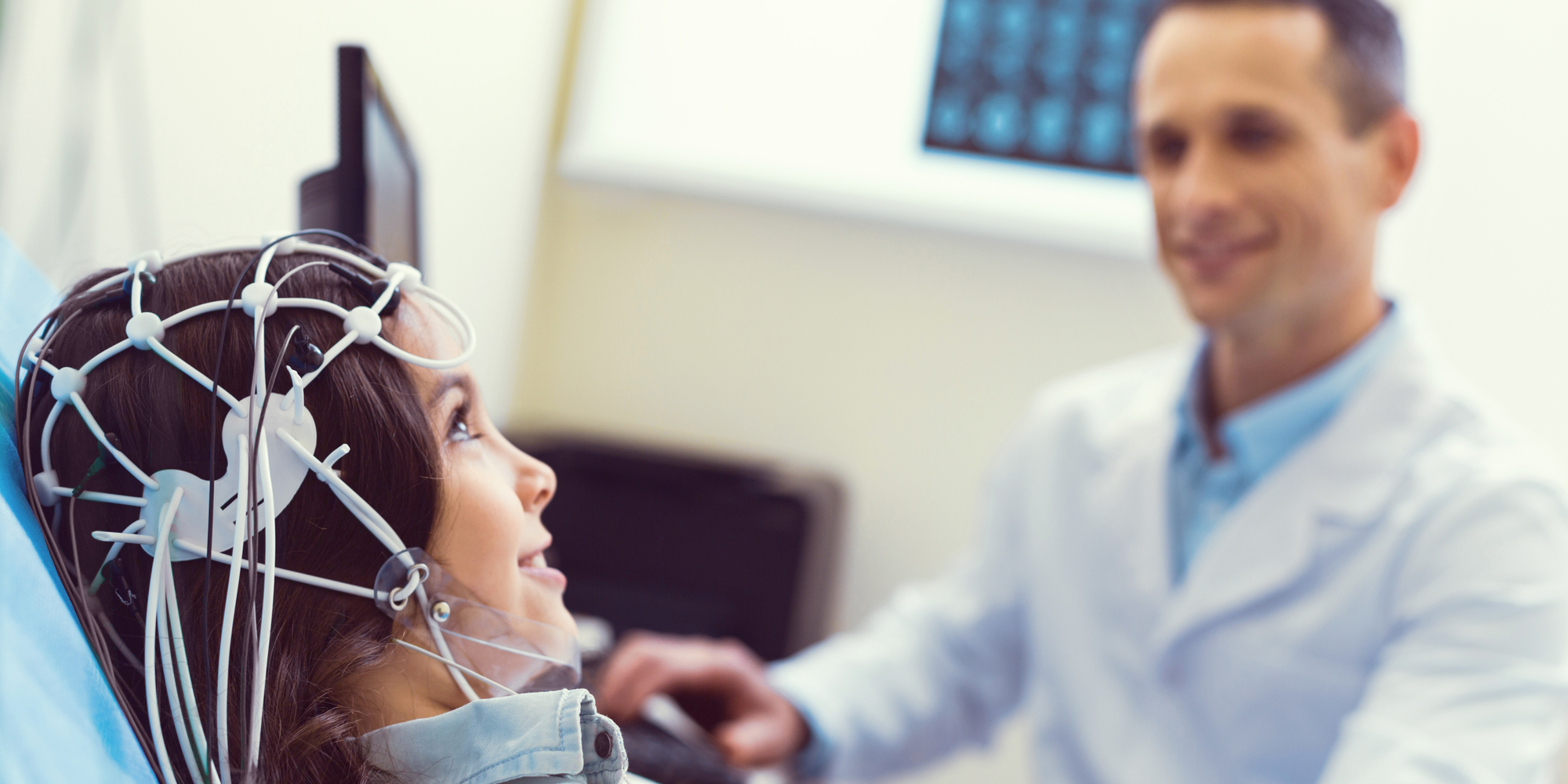 young lady smiling while getting brain analyzed