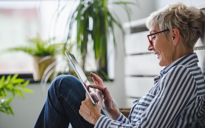 Women sitting on floor with tablet