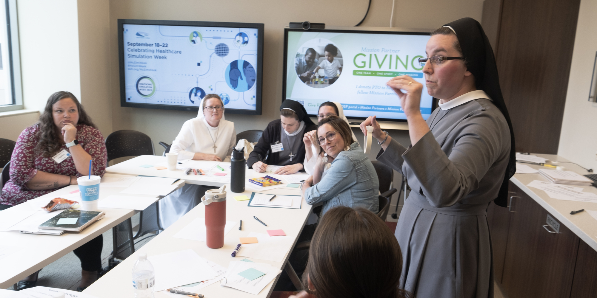 Sister Speaking to a Room of Mission Partners