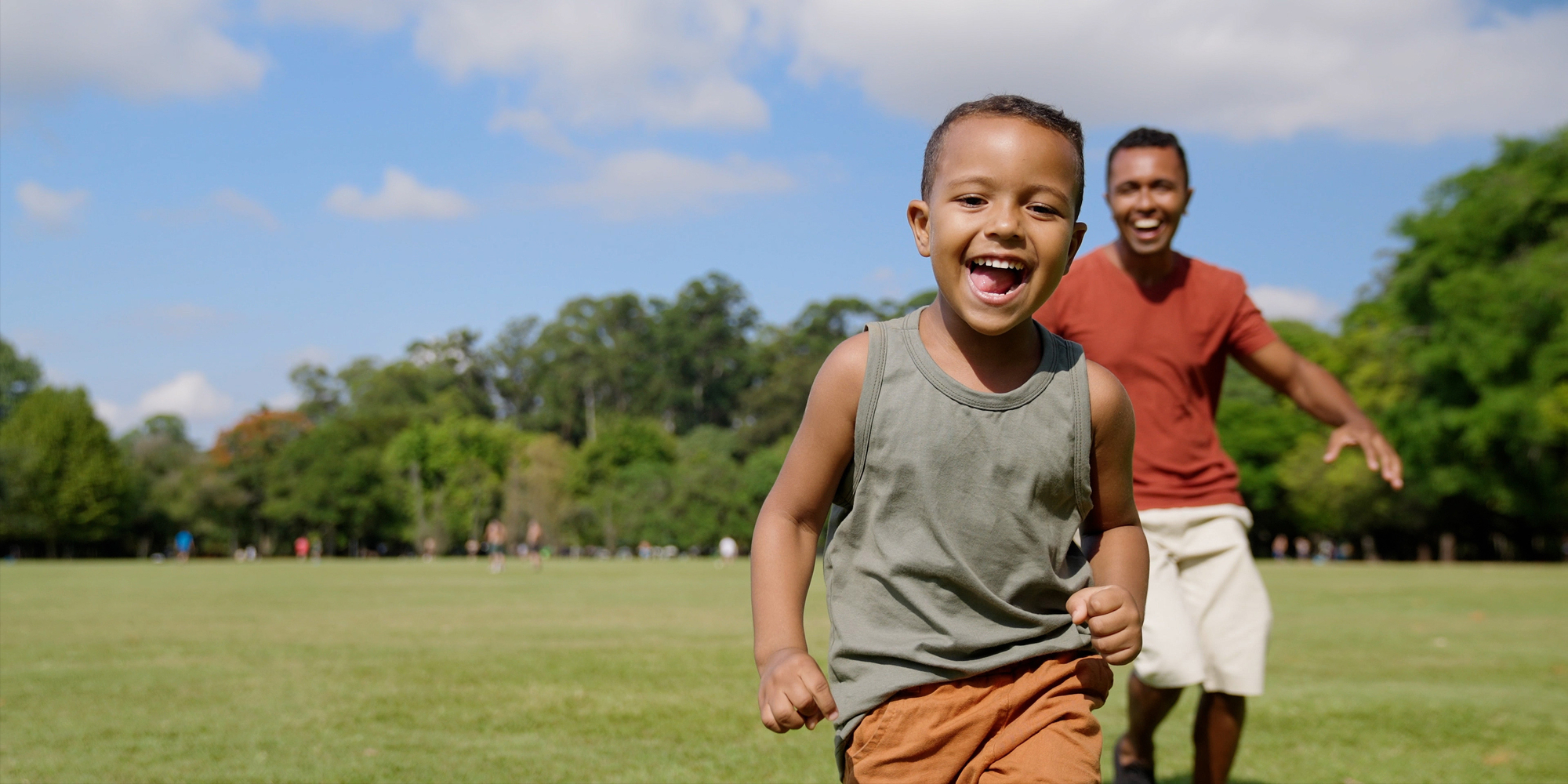 Boy and Male Adult Playing Outside