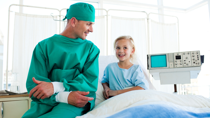 surgeon-with-child-43004629.jpg
