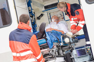 EMS technicians with patient in ambulance