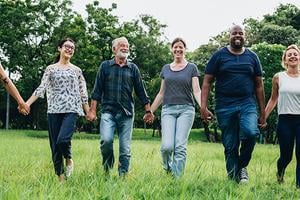 Community Outreach People Holding Hands walking together