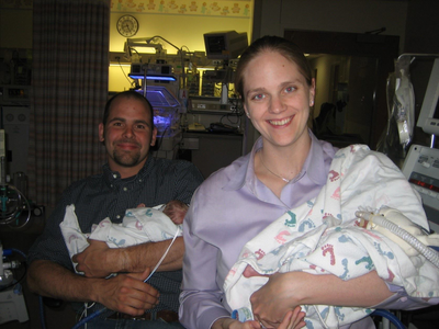 The Mercers posed for their first family photo about a month after the twins were born.