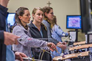 Students interact with training simulators