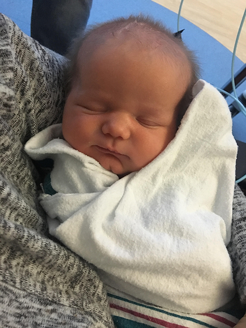 Amanda holding baby Laura for the first time after the 72 hour cooling process