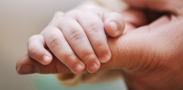 Baby Holding an Adult's Finger