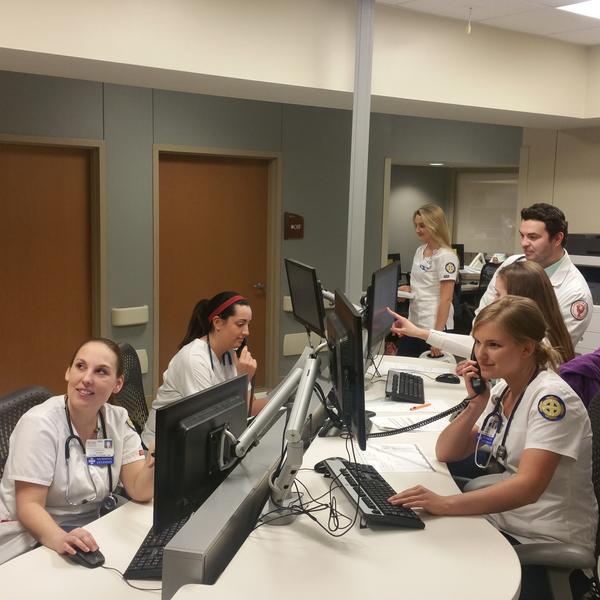 Group of nurses work through simulation in virtual hospital