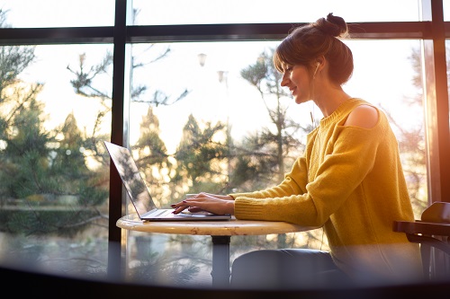 Woman typing on laptop