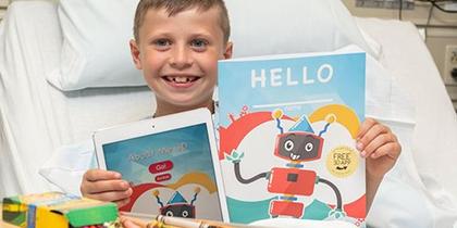 Smiling Boy with PNC Activity Book