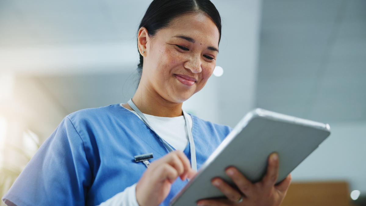 Female nurse using a tablet