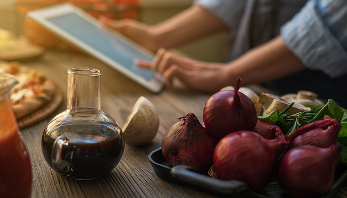 cancer-woman-looking-recipe-in-a-tablet-computer-in-kitchen.png